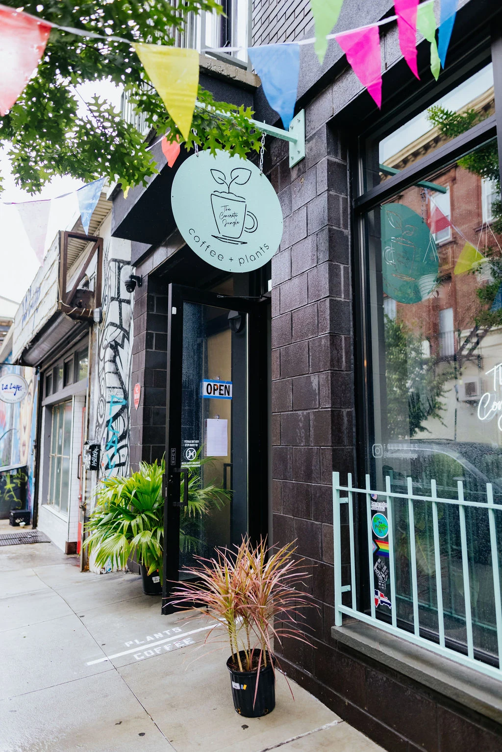 The cafe's mint green sign on Jefferson Street